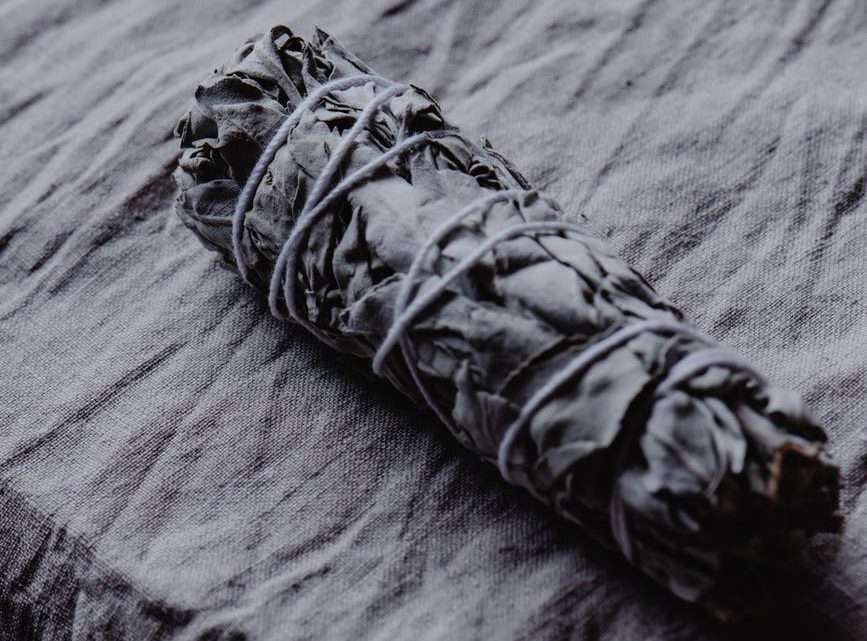 white sage smudge stick on the table